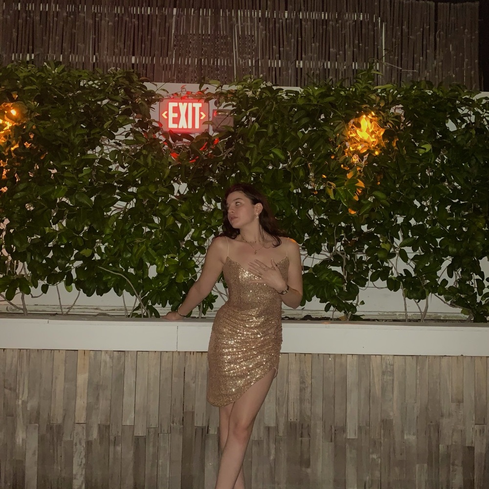 Sequin dress with slit on leg. Gold finish